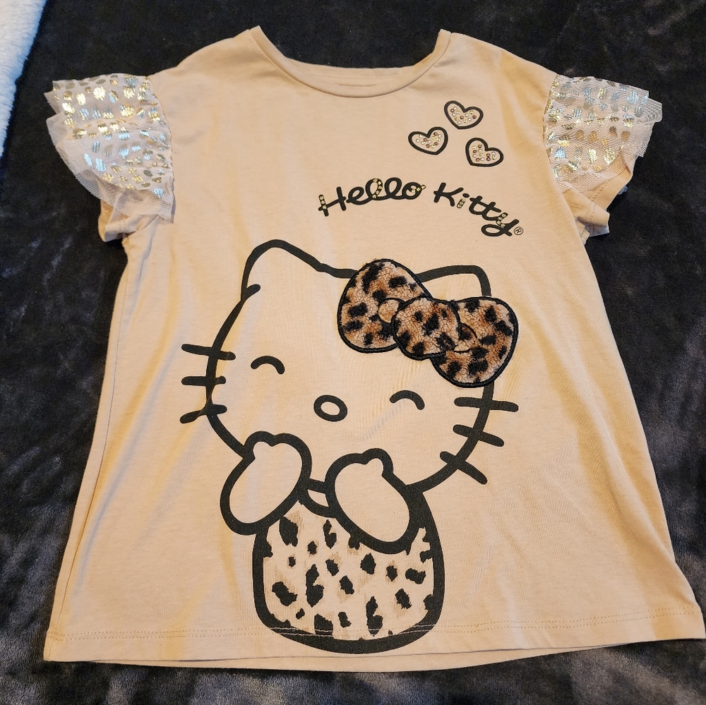 Hello Kitty Top with Fur Leopard Bow. Size 10